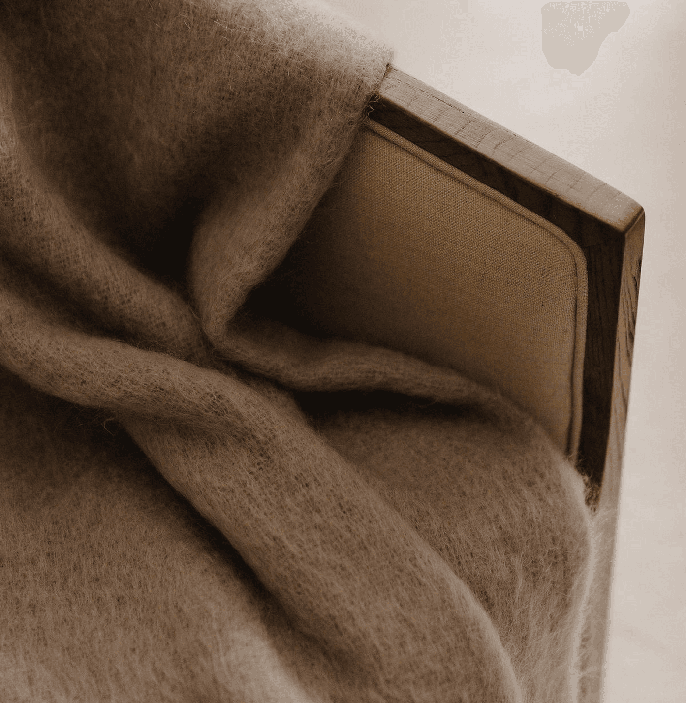 Soft throw blanket draped over a chair